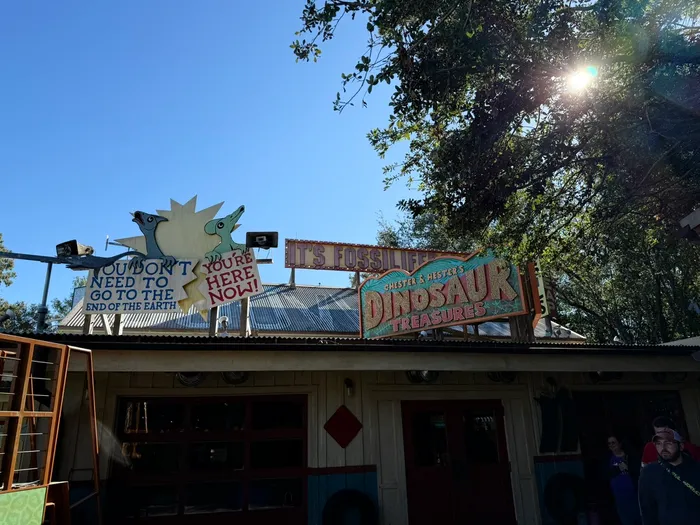 Shop signs in the DinoLand USA area, themed to extinction.